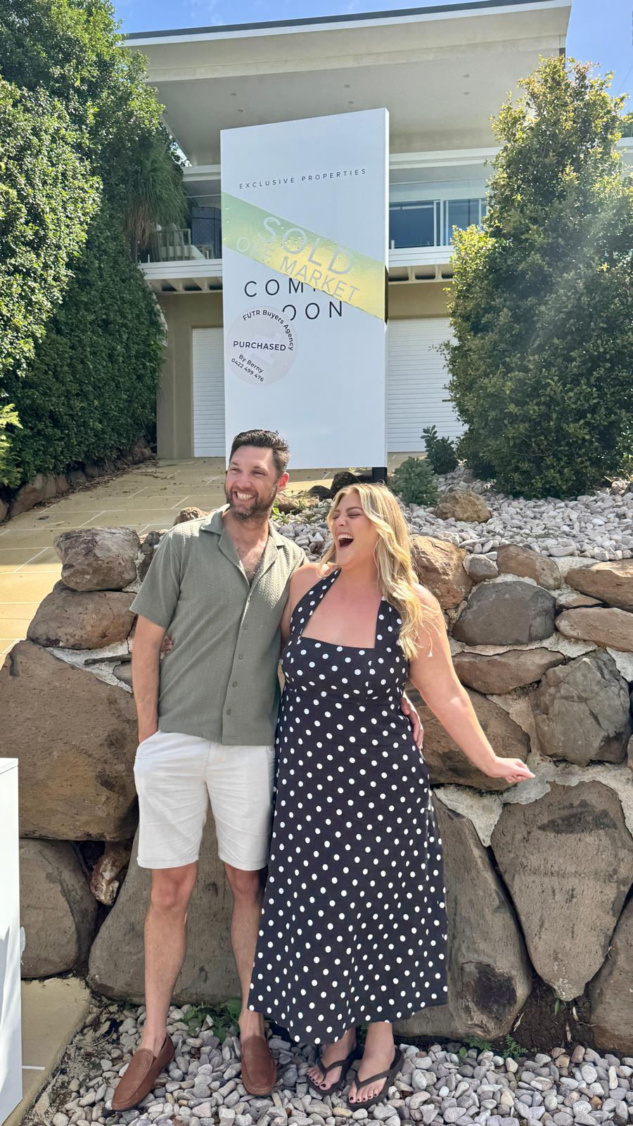 Caitlin & Dean in front of their new home